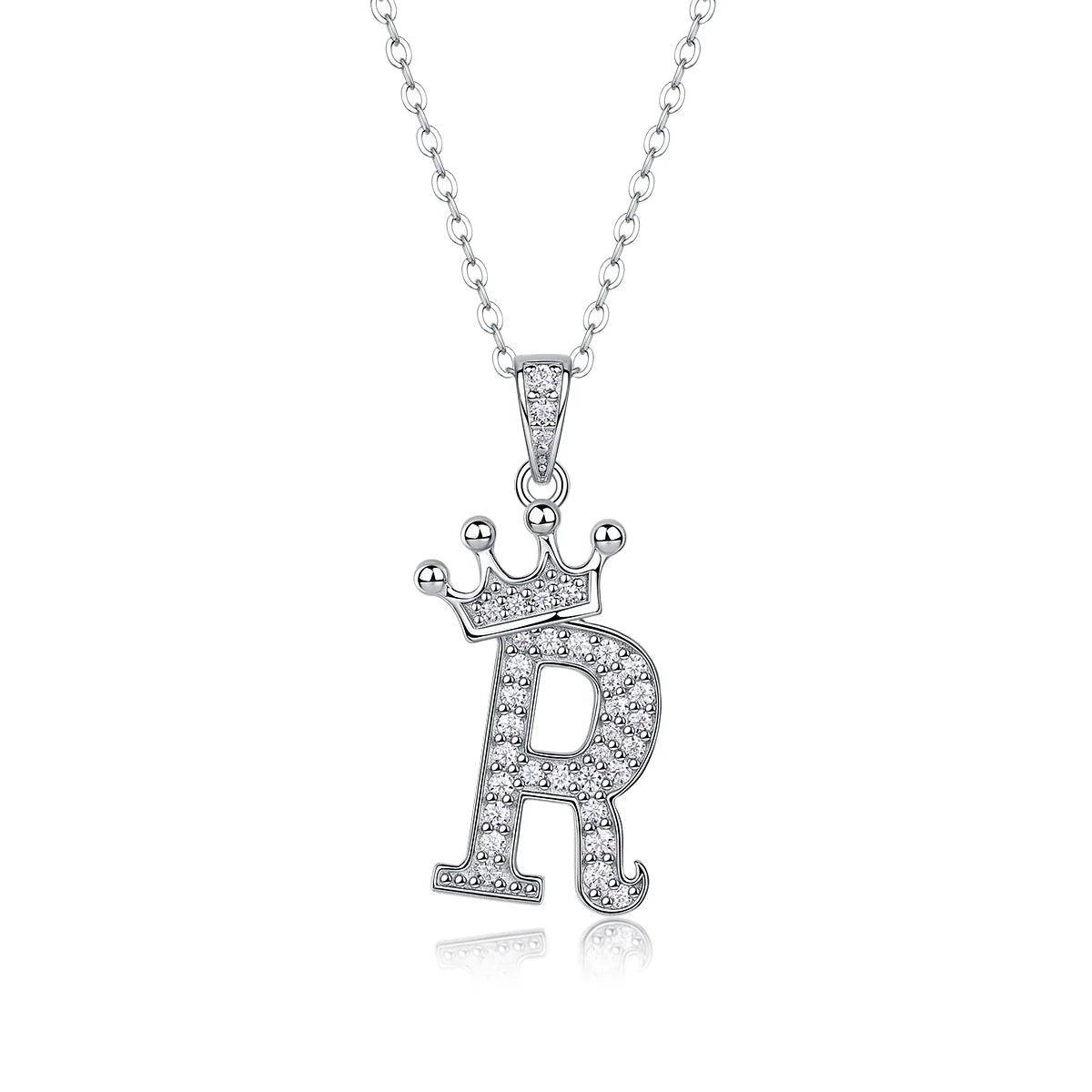 A sterling silver moissanite letter R pendant necklace with a crown design.