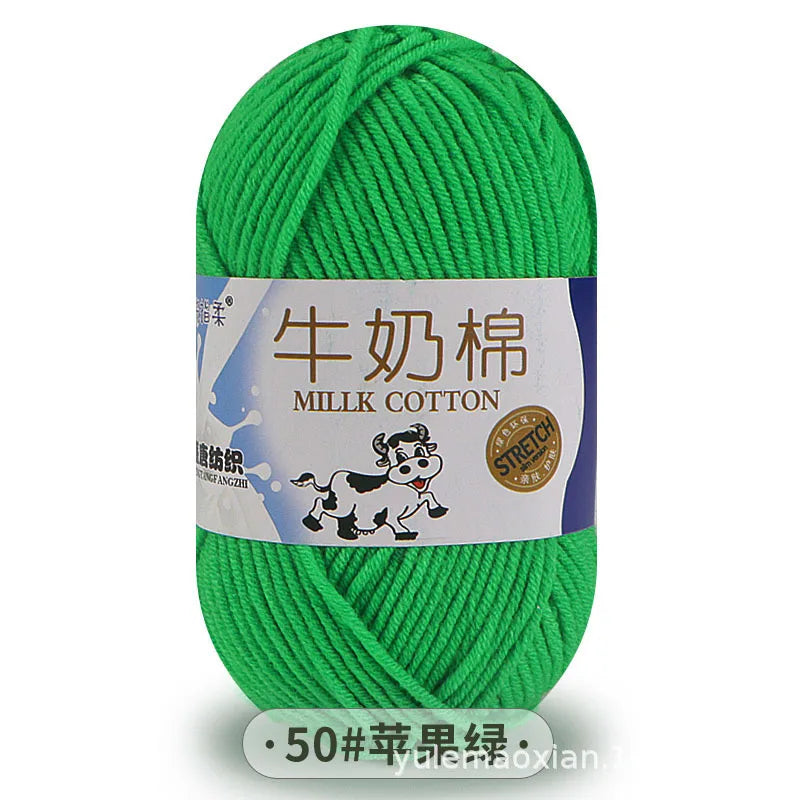 A ball of bright green millk cotton blend yarn labeled for knitting and crochet.