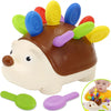 A brown hedgehog sensory toy with a yellow snout and purple features is shown next to its detached parts.