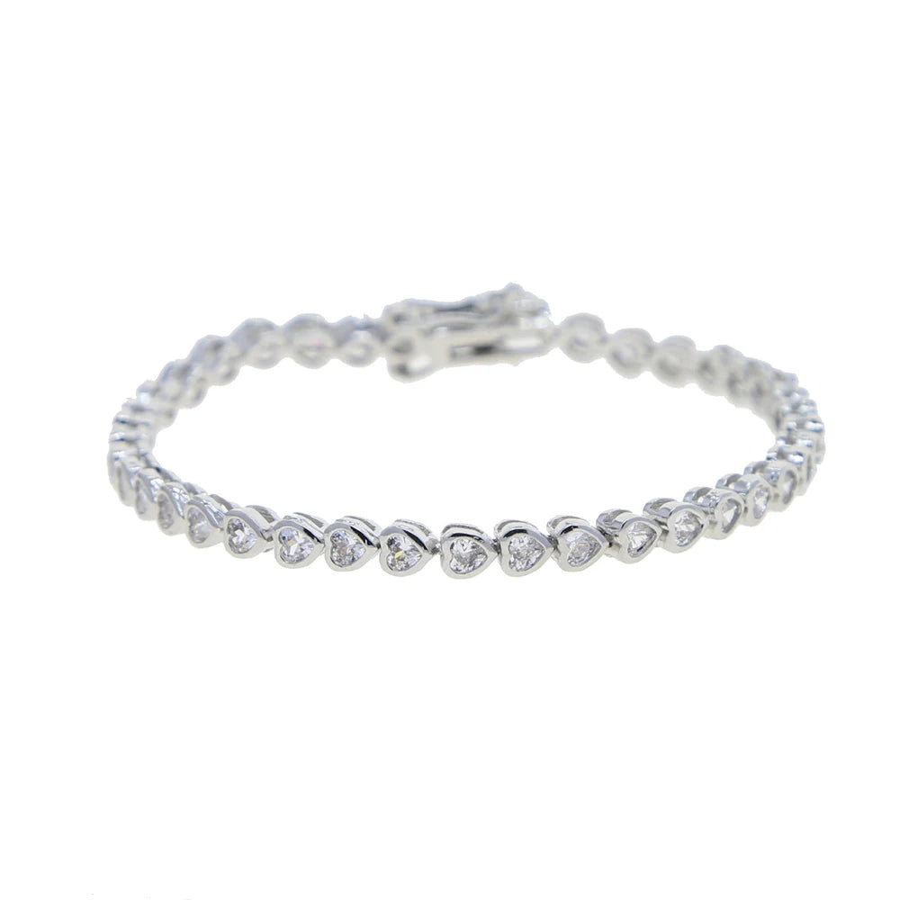 A silver heart tennis bracelet set featuring geometric bezel diamonds.