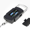 A black portable digital luggage scale with a metal clip and chain attached, showing a refined steel design.