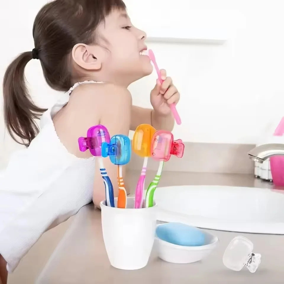 A young girl is using a pink electric toothbrush head in a white case, with several colorful brush heads displayed nearby.