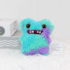 Peluche Monstre Fuggler Mignon et Attachant