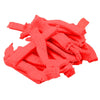 A pile of bright coral pink disposable hair net caps for microblading and permanent makeup.