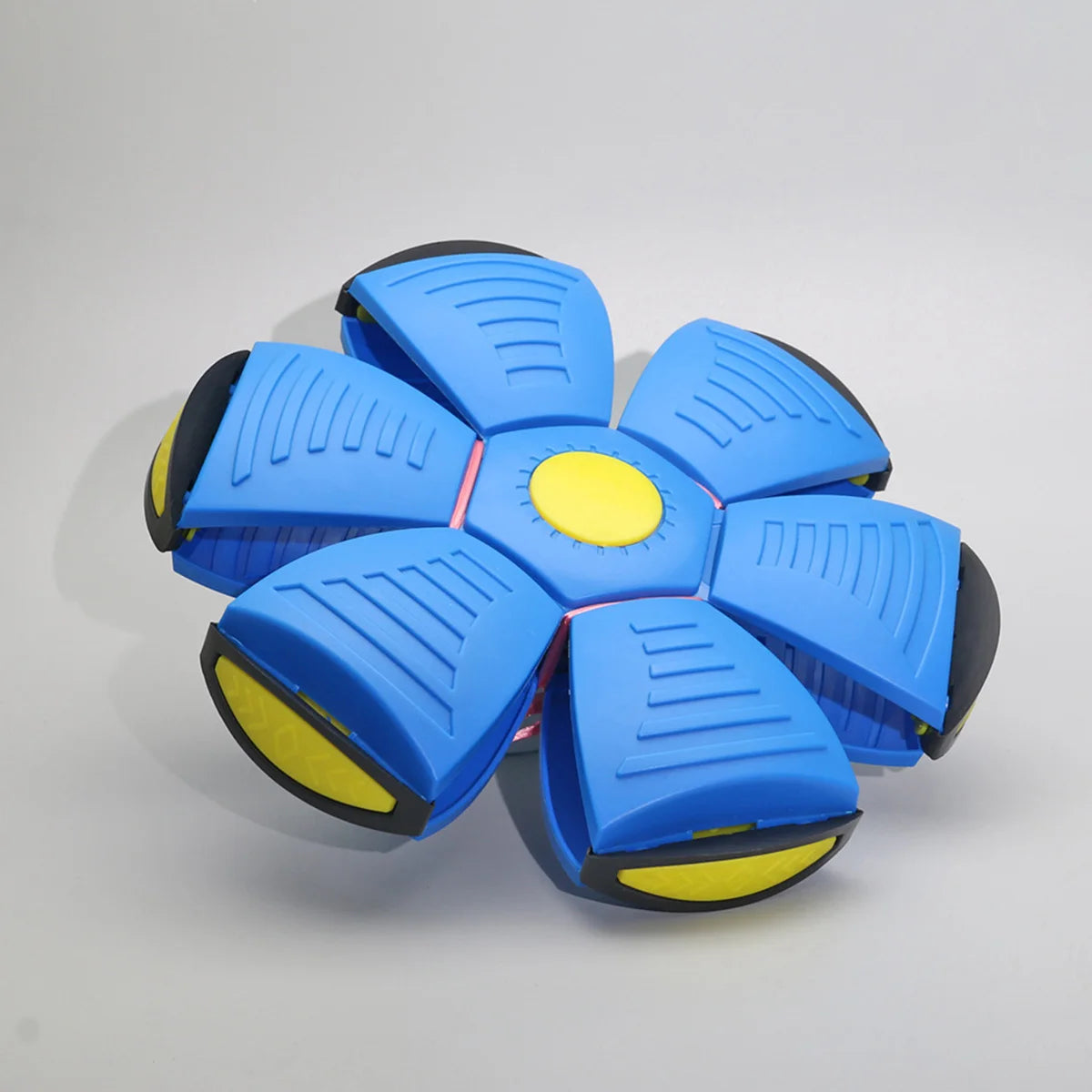 A blue magic flying saucer bouncing ball designed for dogs and kids.