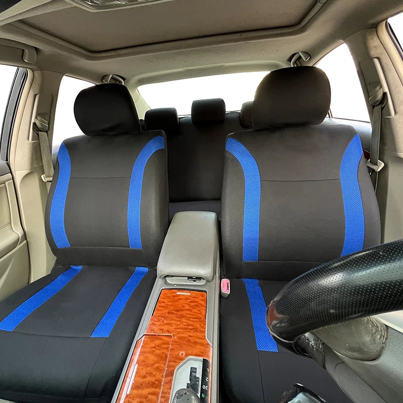 Interior view of a car with two black and blue two-tone seat covers installed.