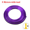 Purple flexible car interior trim strips coiled with a tool.