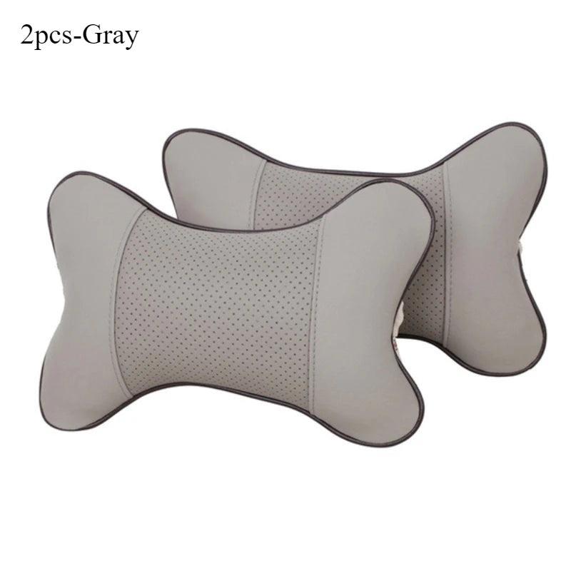 Gray leather knitted car neck pillows with a perforated texture shown from the side.