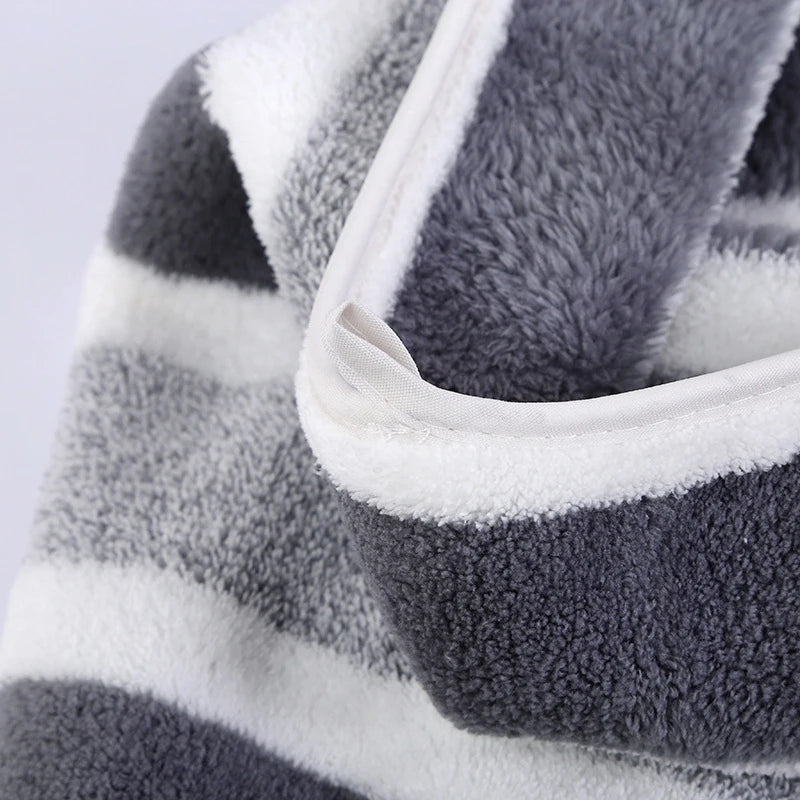 Close-up of a gray and white striped soft absorbent quick-dry bath towel set.