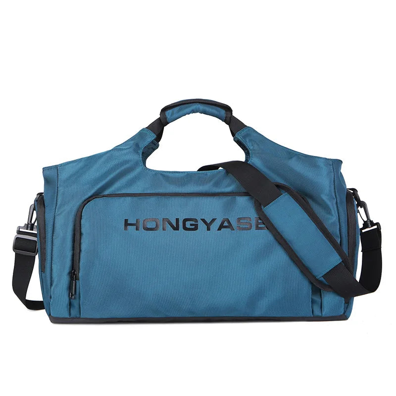 A blue water-resistant duffel bag with a shoulder strap and a front shoe pocket.