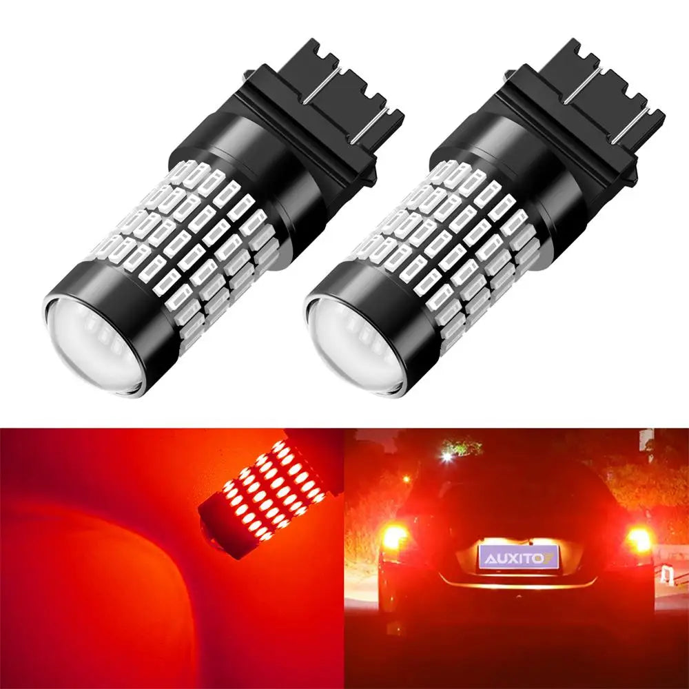 A pair of LED bulbs for brake lights and turn signals, featuring a silver-coated lens and black housing.