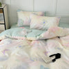 Pink floral bedding set featuring a duvet cover and pillows with butterfly patterns.