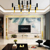A modern interior featuring a large acrylic mirror wall sticker with gold decorative borders and a dark rectangular display.