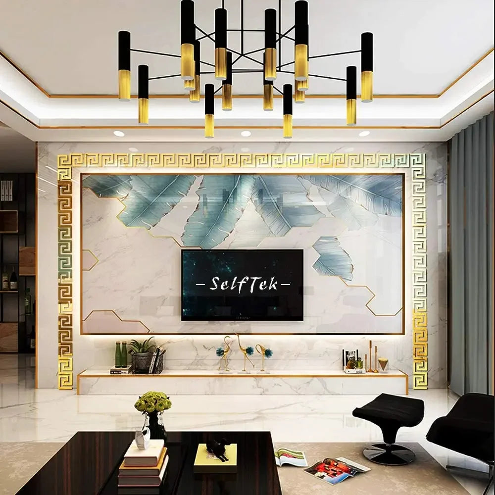 A modern interior featuring a large acrylic mirror wall sticker with gold decorative borders and a dark rectangular display.