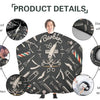 A black waterproof hair cutting cape featuring a barber theme with various tools and patterns.