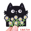 Black cat embroidered iron-on patch with white floral accents