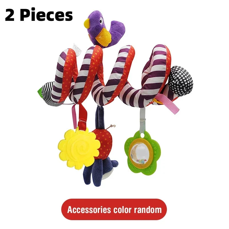 A set of two purple plush toys with striped fabric tails and a yellow accessory hanging from a ring.