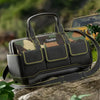 A black plastic reinforcement kit tool kit bag with a camouflage pattern, resting on a rock outdoors.