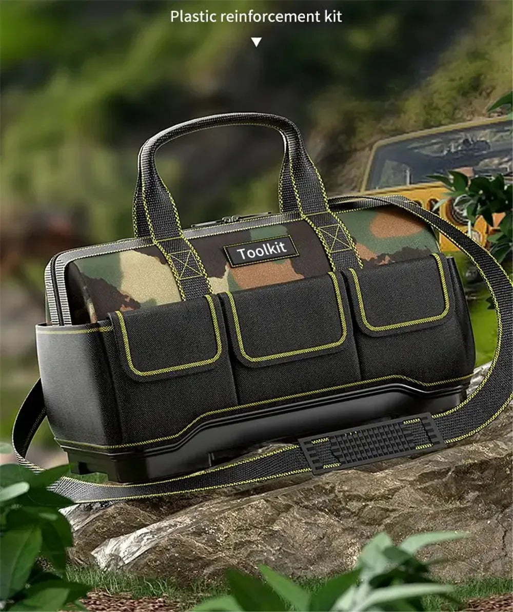 A black plastic reinforcement kit tool kit bag with a camouflage pattern, resting on a rock outdoors.
