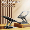A black foldable tablet stand with a 360 degree rotation feature is shown on a wooden surface.