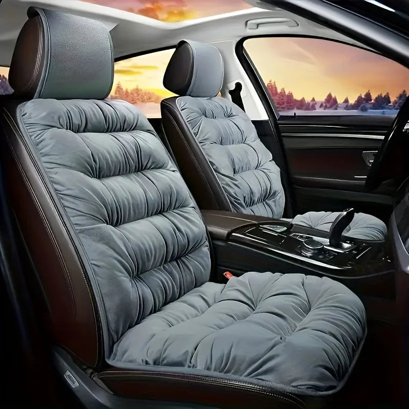 A plush gray winter car seat cover with a padded backrest is shown inside a car cabin.