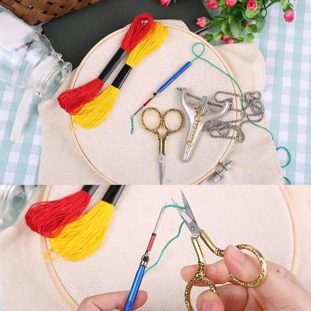 Vintage stainless steel sewing scissors with a chain and embroidery thread on a beige cloth