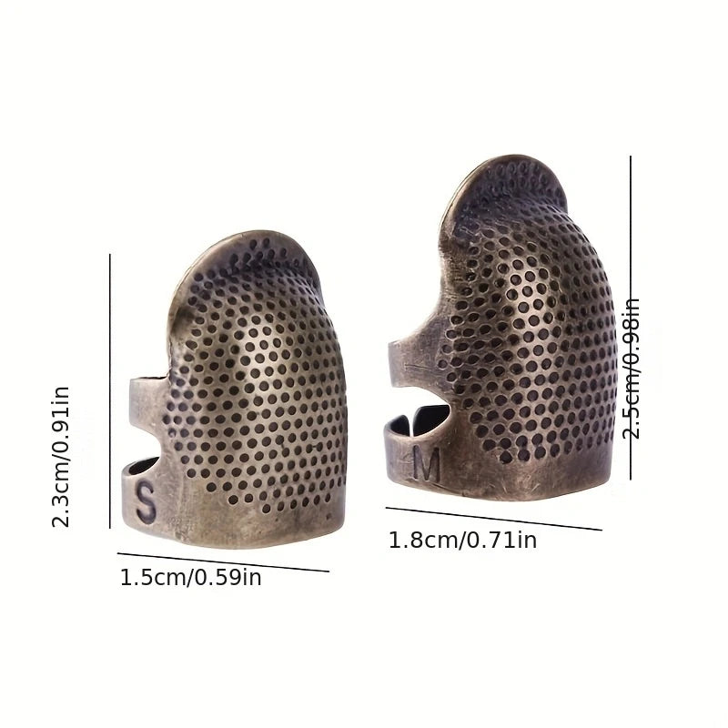 Vintage metal sewing thimble with finger protector ring shown in a side view.