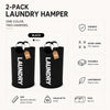 A set of two black extra large foldable laundry hampers with padded handles.