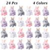 A collection of mini plush bunny toys in four colors pink lavender gray and white arranged in a grid.