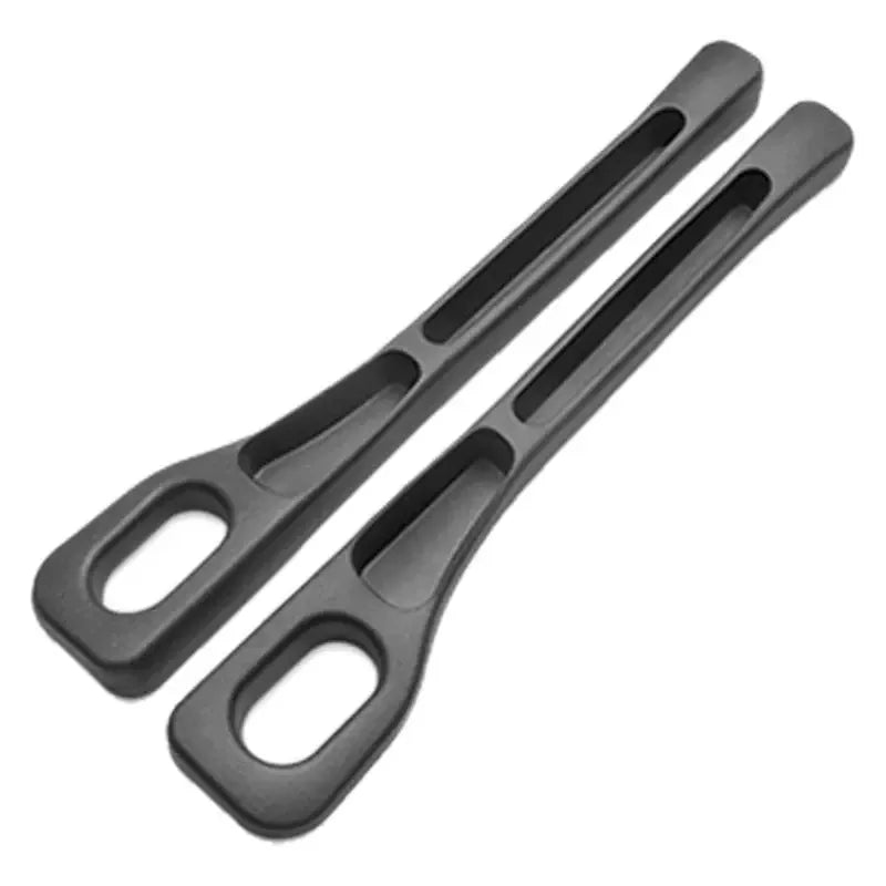 Two black car seat gap plug strips designed to stop items from slipping between seats