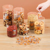 Various dried ingredients and food items are displayed in glass jars with silica gel moisture absorbers.