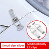 Silver modified body kit clips and a metal latch shown on a white car surface.
