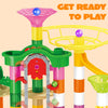 A colorful marble run building set with a motorized elevator and yellow track components for children.