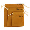 Three velvet drawstring jewelry pouches in shades of brown and orange with different sizes