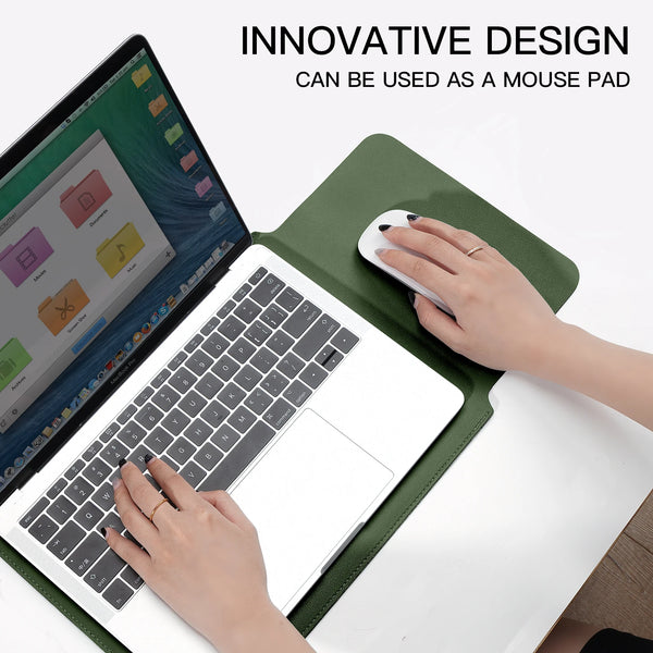A hand is using a white mouse on a laptop, which is placed inside a green PU leather sleeve.