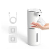 A white touchless automatic soap dispenser with a pump head and charging port is shown next to its components.