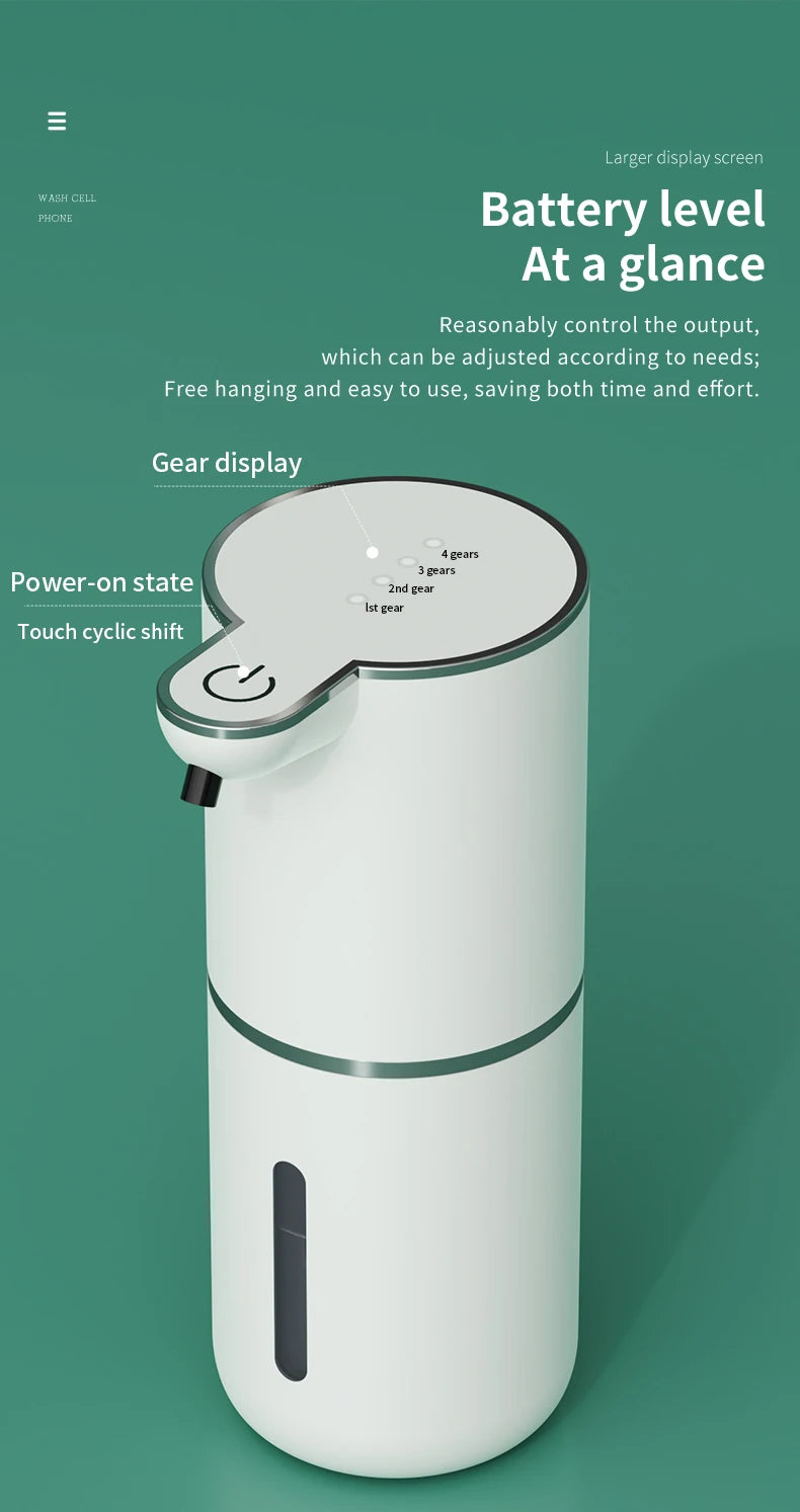 A white touchless automatic soap dispenser with a green accent, shown standing upright.