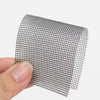 Roll of black self-adhesive window screen repair tape being held by a hand