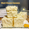 Giant cheese squishy toy showing thick and springy texture in a white block form
