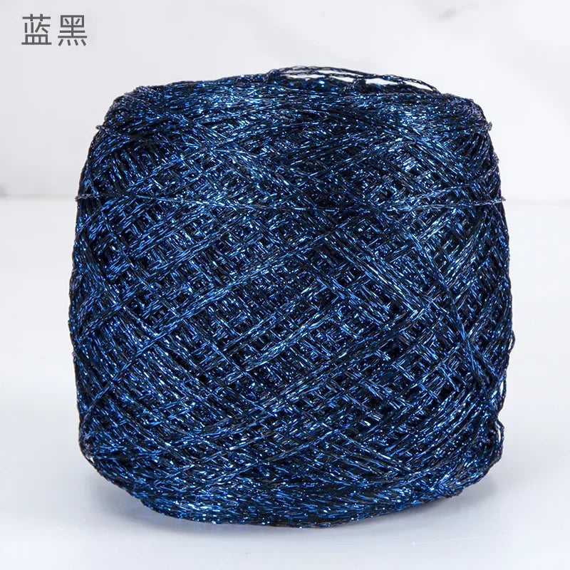 A ball of metallic blue silk crochet yarn with a shimmering texture for knitting and macrame.