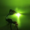 A bright green LED headlight bulb emitting a strong beam against a dark background.