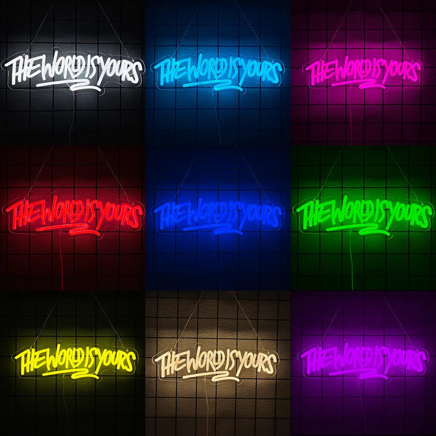 A grid of neon signs displaying the phrase The World Is Yours in various colors including white, blue, pink, red, and green.