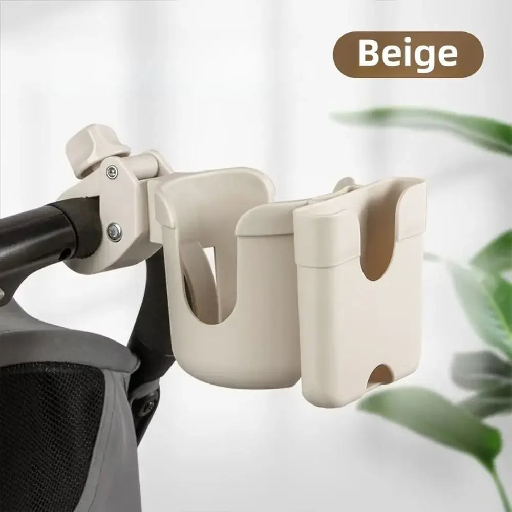 A beige 2-in-1 stroller cup holder and phone mount attached to a stroller handlebar.