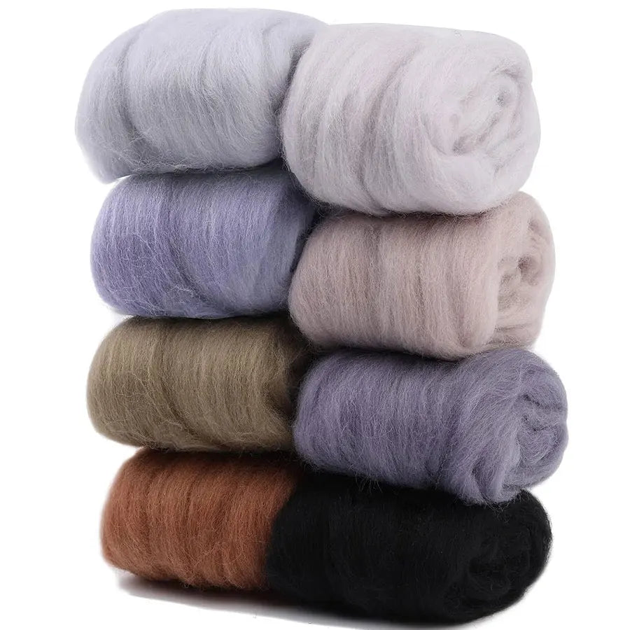 A stack of eight colored wool roving packs for needle felting, including shades of gray, brown, and black.