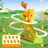 A yellow duck toy designed for stair climbing with lights and music set in a grassy outdoor environment.