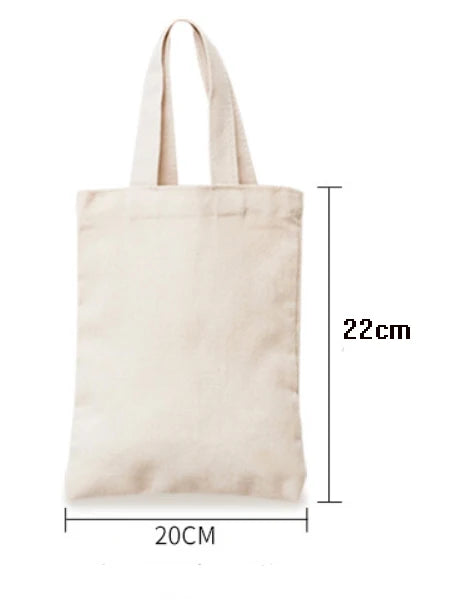 A light beige canvas tote bag with handles, shown from the front and side view.