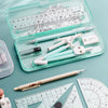 A collection of geometry drawing tools including an eraser, protractor, pencil, lead, compass, and ruler set.