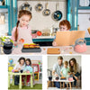 A child is playing in a pretend kitchen set with pots, pans, and food items.