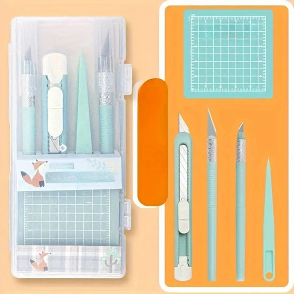 A clear plastic case containing a set of precision art cutting tools including various blades and guides.