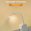 A white mini night-light clip-on LED book light is shown illuminating a surface.